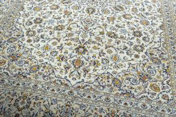 Close-up detail of 2000s Kashan rug from Iran / Persia showing Wool weave