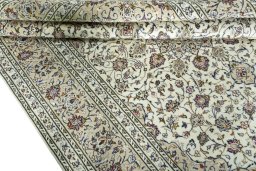 Close-up detail of 2000s Kashan rug from Iran / Persia showing Wool weave