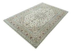 Corner detail of 2000s Kashan rug showing border pattern and Wool pile