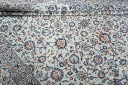 Close-up detail of 2000s Kashan rug from Iran / Persia showing Wool weave