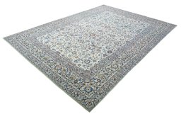 Corner detail of 2000s Kashan rug showing border pattern and Wool pile