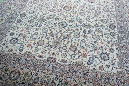 Close-up detail of 2000s Kashan rug from Iran / Persia showing Wool weave