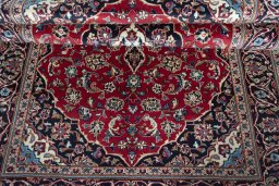 Close-up detail of 2000s Kashan rug from Iran / Persia showing Wool weave