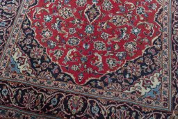 Close-up detail of 2000s Kashan rug from Iran / Persia showing Wool weave