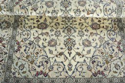 Close-up detail of 2000s Kashan rug from Iran / Persia showing Wool weave