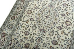 Backside of handmade 2000s Kashan rug showing knot structure and weave density