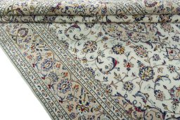 Close-up detail of 2000s Kashan rug from Iran / Persia showing Wool weave