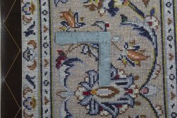 Backside of handmade 2000s Kashan rug showing knot structure and weave density