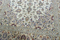 Close-up detail of 2000s Kashan rug from Iran / Persia showing Wool weave