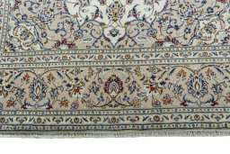 Full view of 2000s Kashan rug from Iran / Persia, 297 × 196 cm in Beige tones