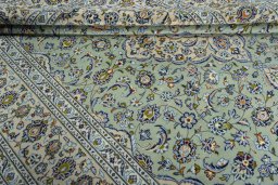 Close-up detail of 2000s Kashan rug from Iran / Persia showing Wool weave