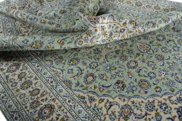 Surface texture of 2000s Kashan rug with natural Wool and intricate pattern