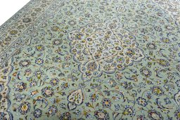 Backside of handmade 2000s Kashan rug showing knot structure and weave density