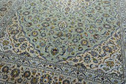 Close-up detail of 2000s Kashan rug from Iran / Persia showing Wool weave