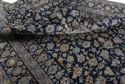 Close-up detail of 2000s Kashan rug from Iran / Persia showing Wool weave