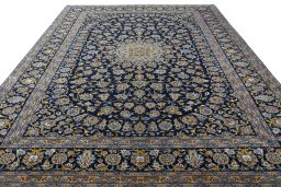 Surface texture of 2000s Kashan rug with natural Wool and intricate pattern