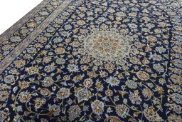 Backside of handmade 2000s Kashan rug showing knot structure and weave density