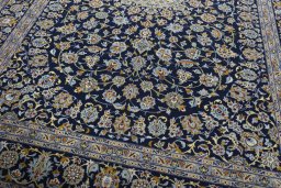 Close-up detail of 2000s Kashan rug from Iran / Persia showing Wool weave