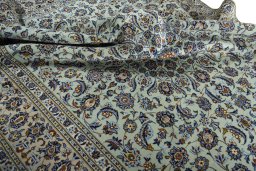Surface texture of 2000s Kashan rug with natural Wool and intricate pattern