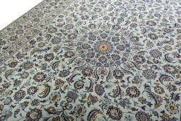 Backside of handmade 2000s Kashan rug showing knot structure and weave density