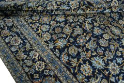 Close-up detail of 2000s Kashan rug from Iran / Persia showing Wool weave
