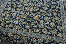 Close-up detail of 2000s Kashan rug from Iran / Persia showing Wool weave