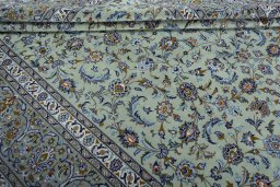 Close-up detail of 2000s Kashan rug from Iran / Persia showing Wool weave