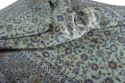Surface texture of 2000s Kashan rug with natural Wool and intricate pattern