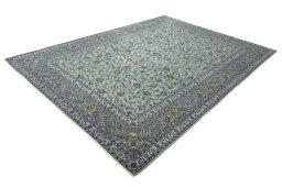Corner detail of 2000s Kashan rug showing border pattern and Wool pile