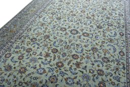 Backside of handmade 2000s Kashan rug showing knot structure and weave density