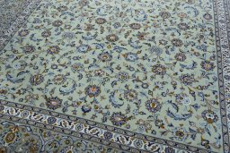 Close-up detail of 2000s Kashan rug from Iran / Persia showing Wool weave