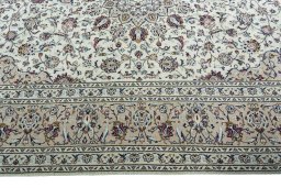Corner detail of 2000s Kashan rug showing border pattern and Wool pile