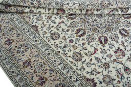 Close-up detail of 2000s Kashan rug from Iran / Persia showing Wool weave