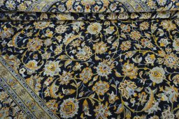 Close-up detail of 2000s Kashan rug from Iran / Persia showing Wool weave