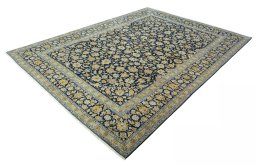 Corner detail of 2000s Kashan rug showing border pattern and Wool pile