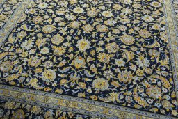 Close-up detail of 2000s Kashan rug from Iran / Persia showing Wool weave