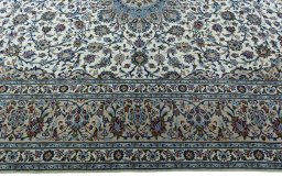 Corner detail of 2000s Kashan rug showing border pattern and Wool pile