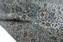 Surface texture of 2000s Kashan rug with natural Wool and intricate pattern