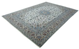 Corner detail of 2000s Kashan rug showing border pattern and Wool pile