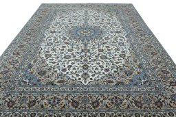 Surface texture of 2000s Kashan rug with natural Wool and intricate pattern