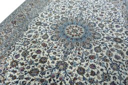 Backside of handmade 2000s Kashan rug showing knot structure and weave density