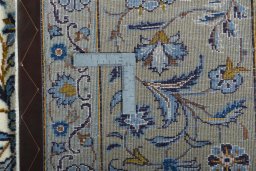 Central medallion detail of 2000s Kashan rug from Iran / Persia