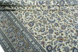 Close-up detail of 2000s Kashan rug from Iran / Persia showing Wool weave