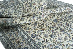 Surface texture of 2000s Kashan rug with natural Wool and intricate pattern