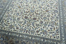 Close-up detail of 2000s Kashan rug from Iran / Persia showing Wool weave