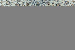 Corner detail of 2000s Kashan rug showing border pattern and Wool pile