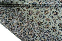 Close-up detail of 2000s Kashan rug from Iran / Persia showing Wool weave