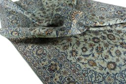 Surface texture of 2000s Kashan rug with natural Wool and intricate pattern