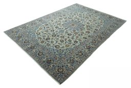 Corner detail of 2000s Kashan rug showing border pattern and Wool pile