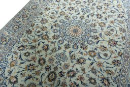 Backside of handmade 2000s Kashan rug showing knot structure and weave density
